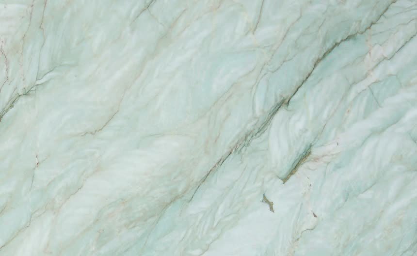 Gaya Quartzite — close view of the stone surface. Green-grey structure broken by pale crystalline seams.
